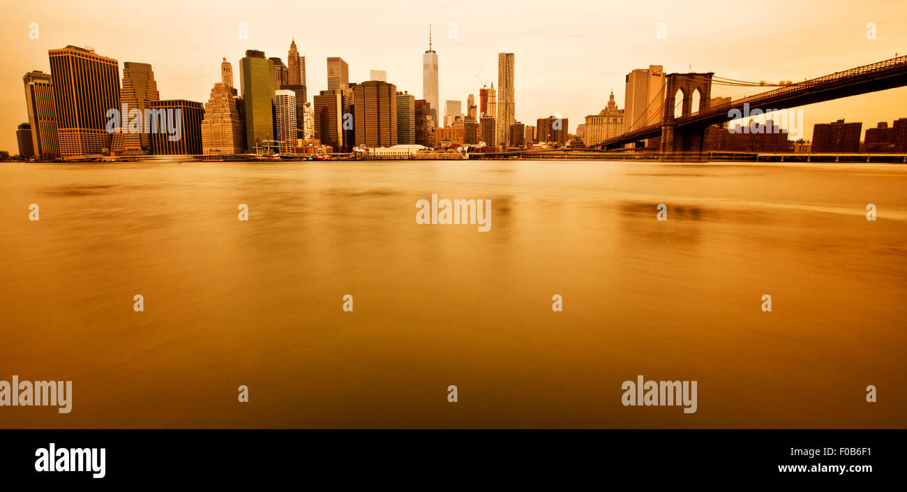 New York - Panoramic view of Manhattan Skyline and Brooklyn Bridge Stock Photo