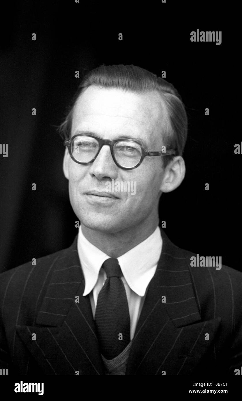 Portrait of a middle aged man wearing a suit and round glasses. Stock Photo