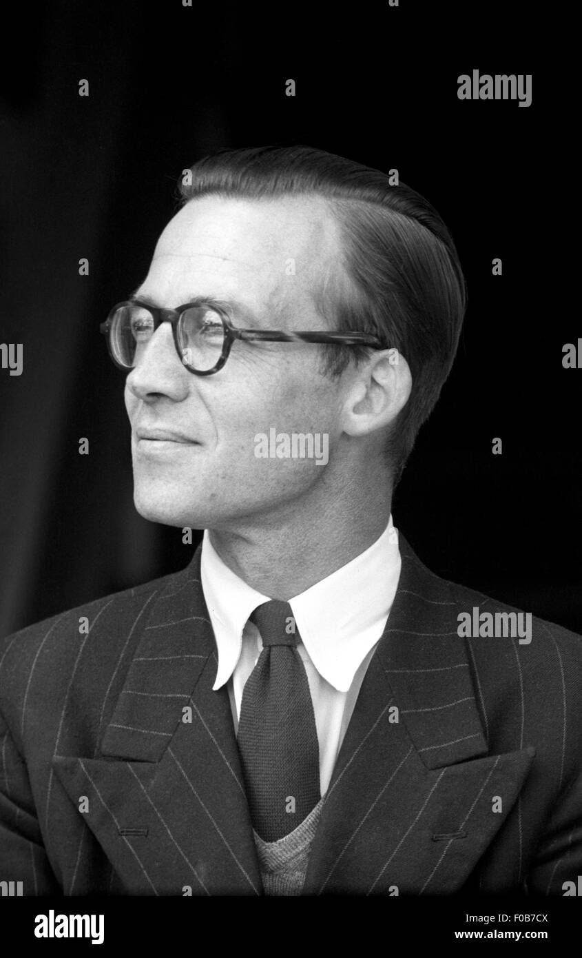 Portrait of a middle aged man wearing a suit and round glasses. Stock Photo