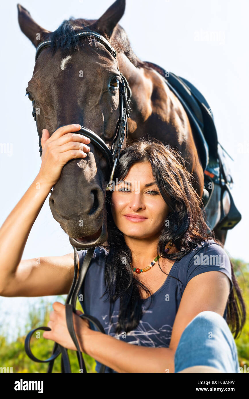 Portrait of a beautiful woman in a horse. Stock Photo