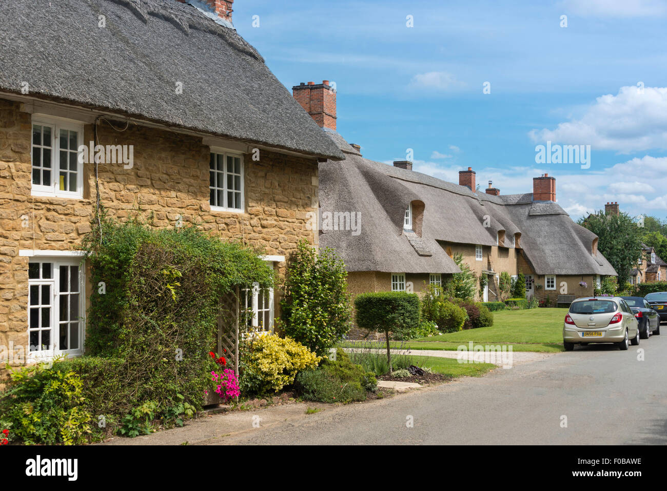 Thatched cottages, Main Street, Ashby St Ledgers, Northamptonshire, England, United Kingdom Stock Photo