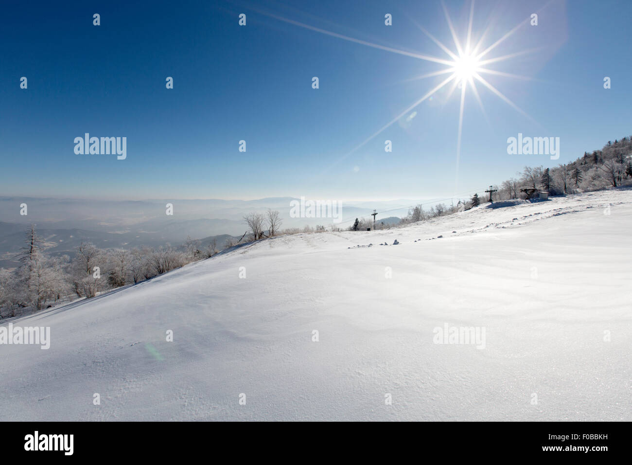 Sun shining on snow, China Stock Photo