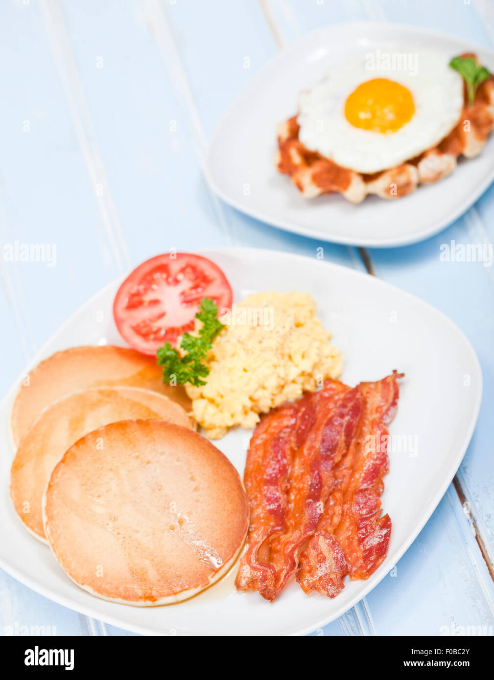 American style breakfast of pancakes, bacon and eggs Stock Photo Alamy