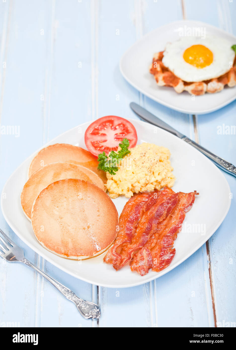 American style breakfast of pancakes, bacon and eggs Stock Photo Alamy