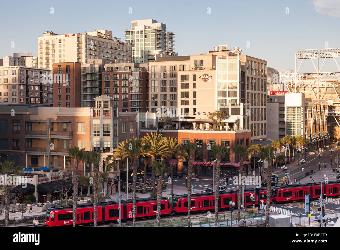 San Diego cityscape from E. Harbor Drive looking over the MTS trolley to the Hard Rock Hotel, Nobo, Lou and Mickey's Steaks, USA Stock Photo