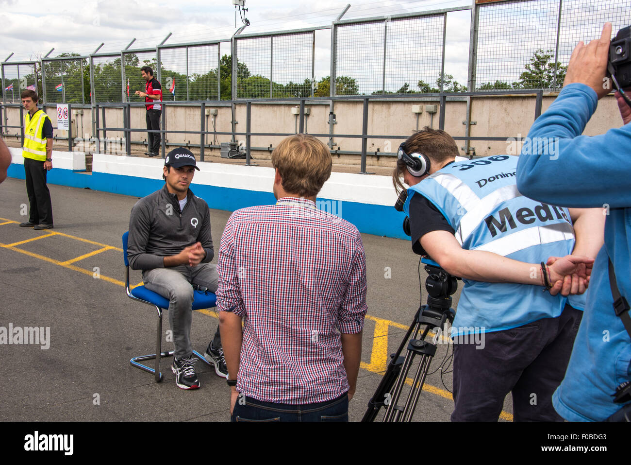 Racing Driver Nelson Piquet Jr Being Interviewed In The Pits During A 