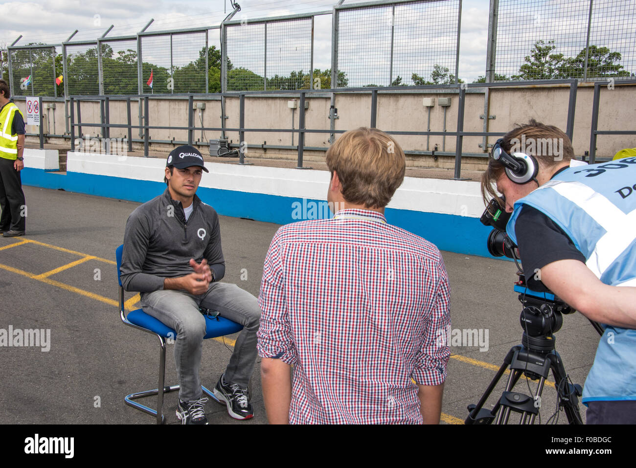 Racing Driver Nelson Piquet Jr Being Interviewed In The Pits During A 