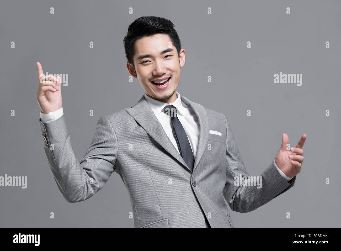 Happy young businessman Stock Photo - Alamy