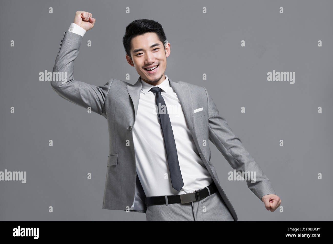 Happy young businessman Stock Photo - Alamy