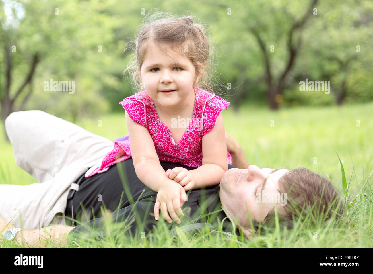 Father and daughter in forest on a meadow Stock Photo - Alamy