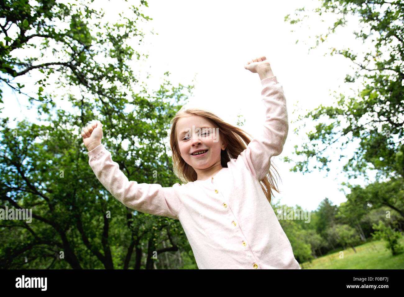 Adorable little girl in the forest meadow Stock Photo - Alamy