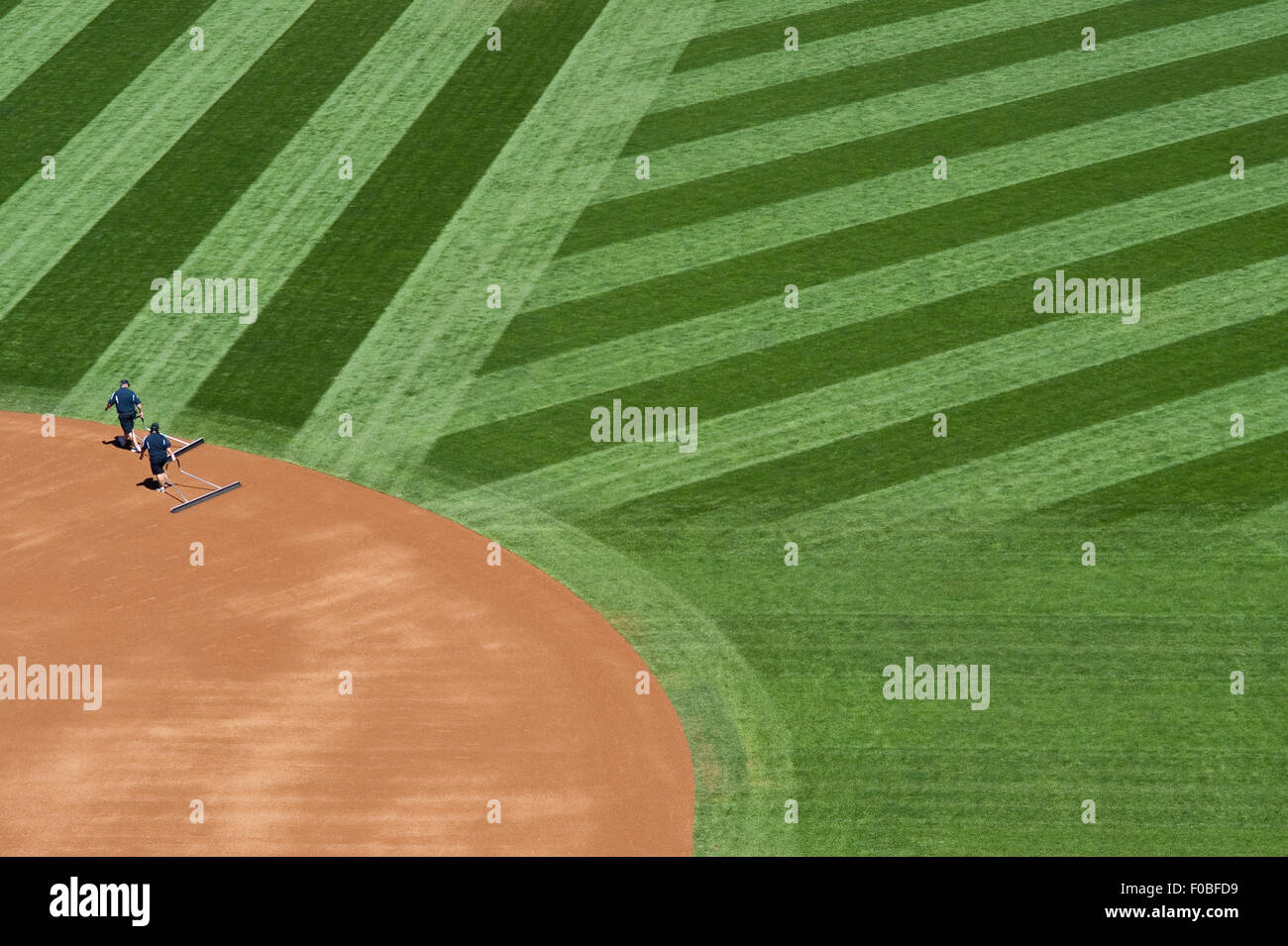 Baseball field abstract patterns with ground crew preparing the field