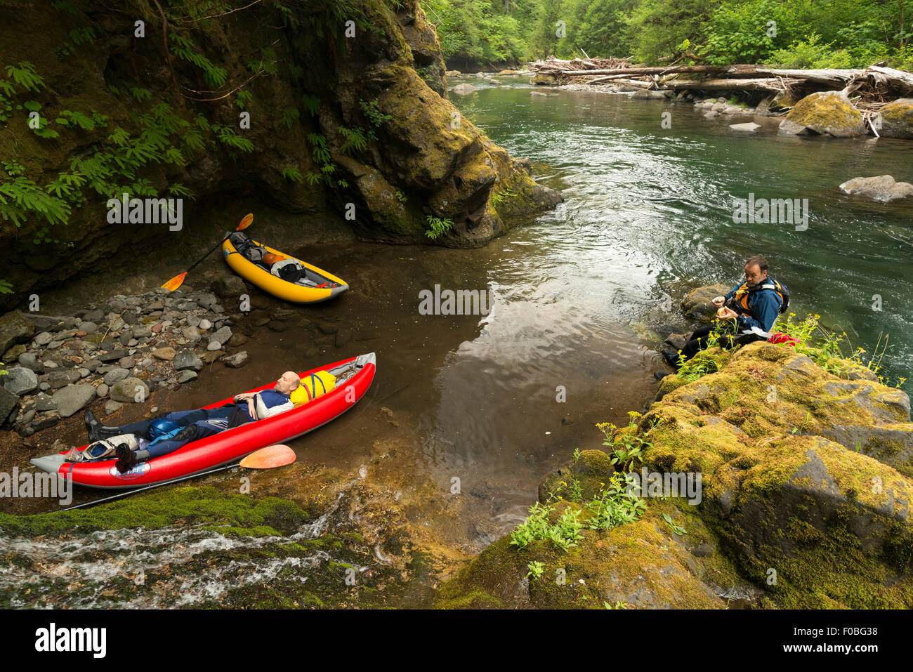 Paddlers taking a lunch and nap break, Salmon Creek, Oregon. Stock Photo
