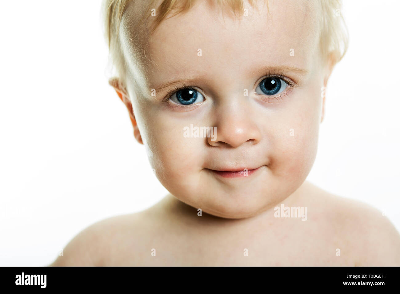 Portrait close-up of the little boy with blonde hair and blue eyes Stock Photo