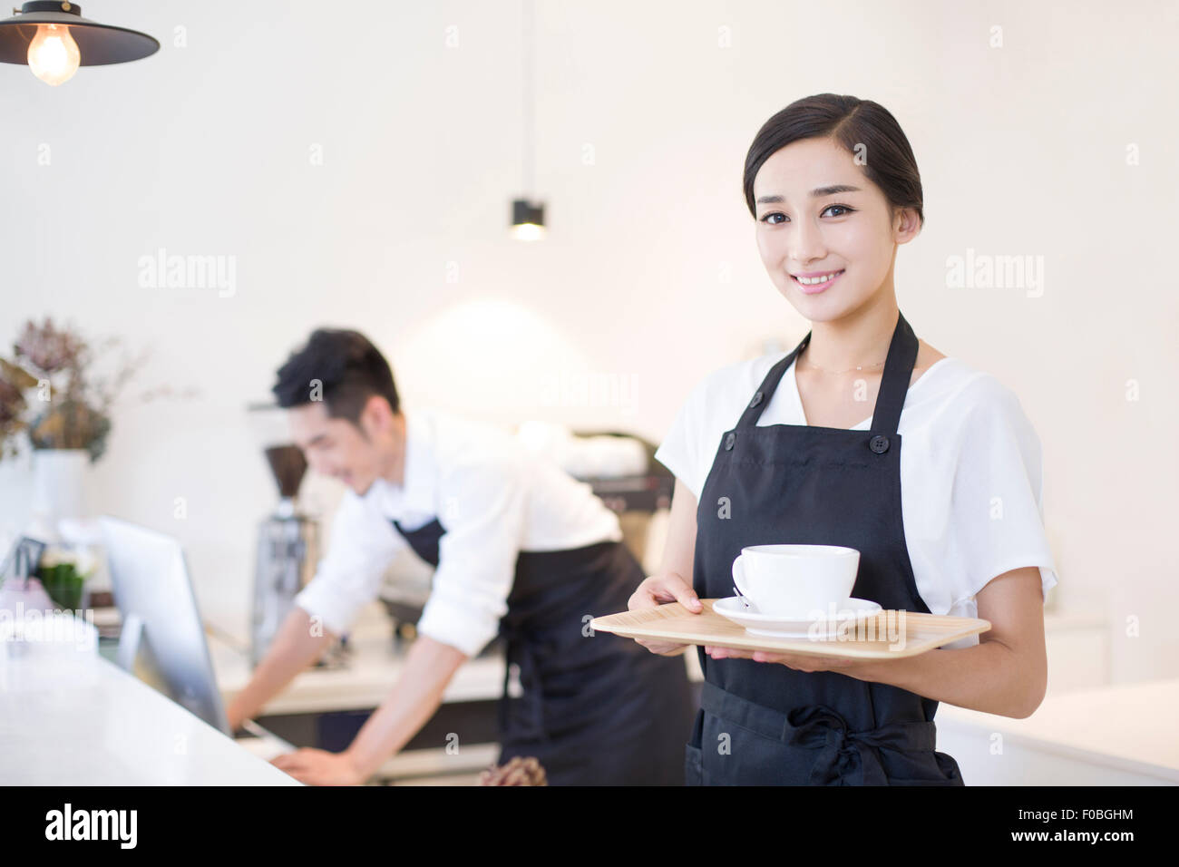 Portrait of coffee shop waitress Stock Photo Alamy