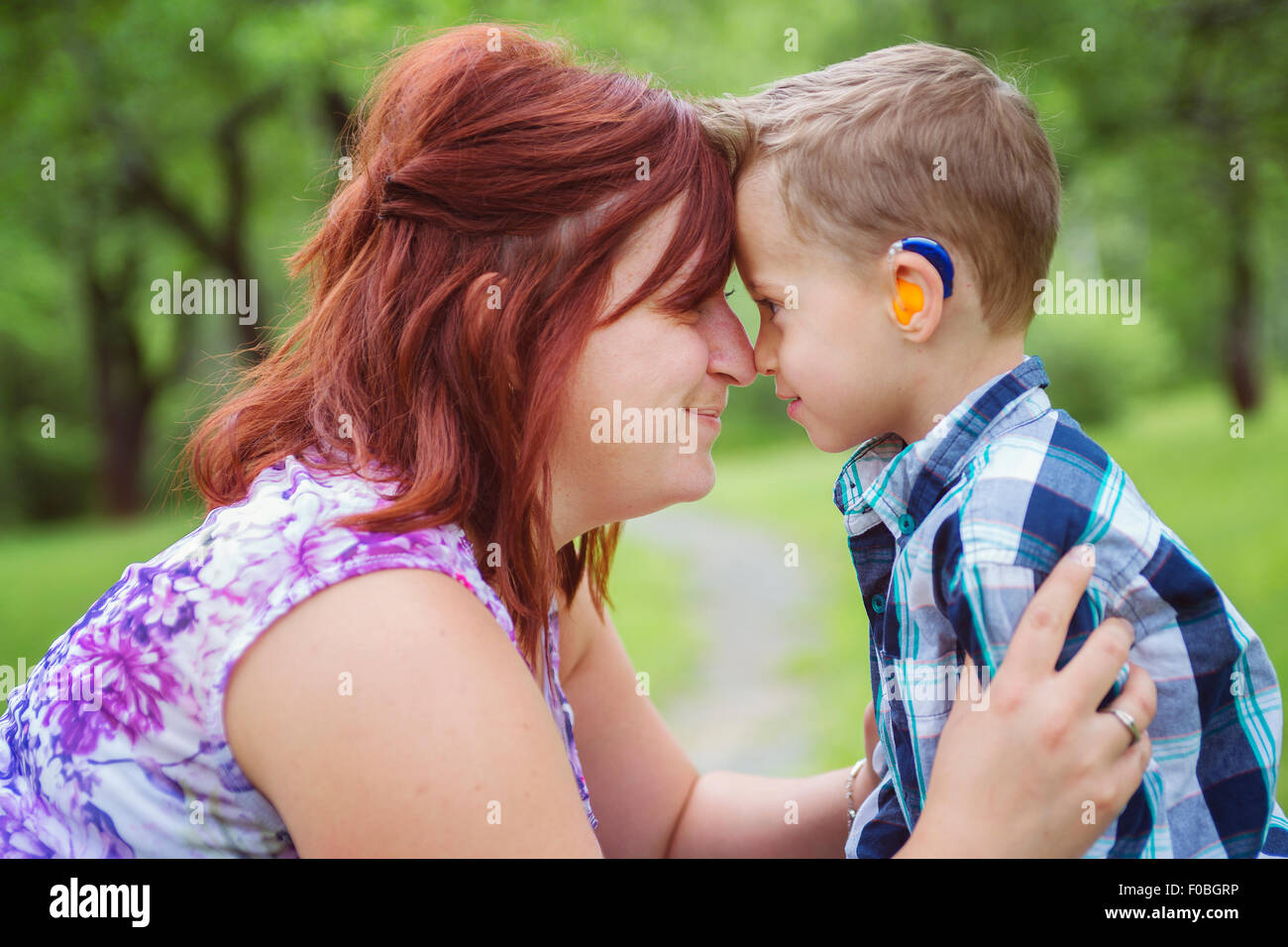 Mother and son in forest having fun Stock Photo