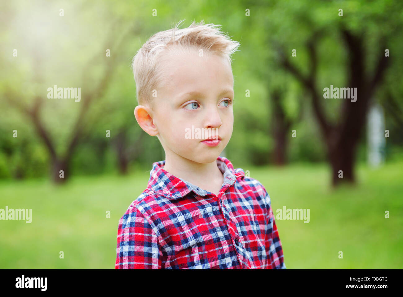 Portrait of cute little boy child outdoors on the nature Stock Photo ...
