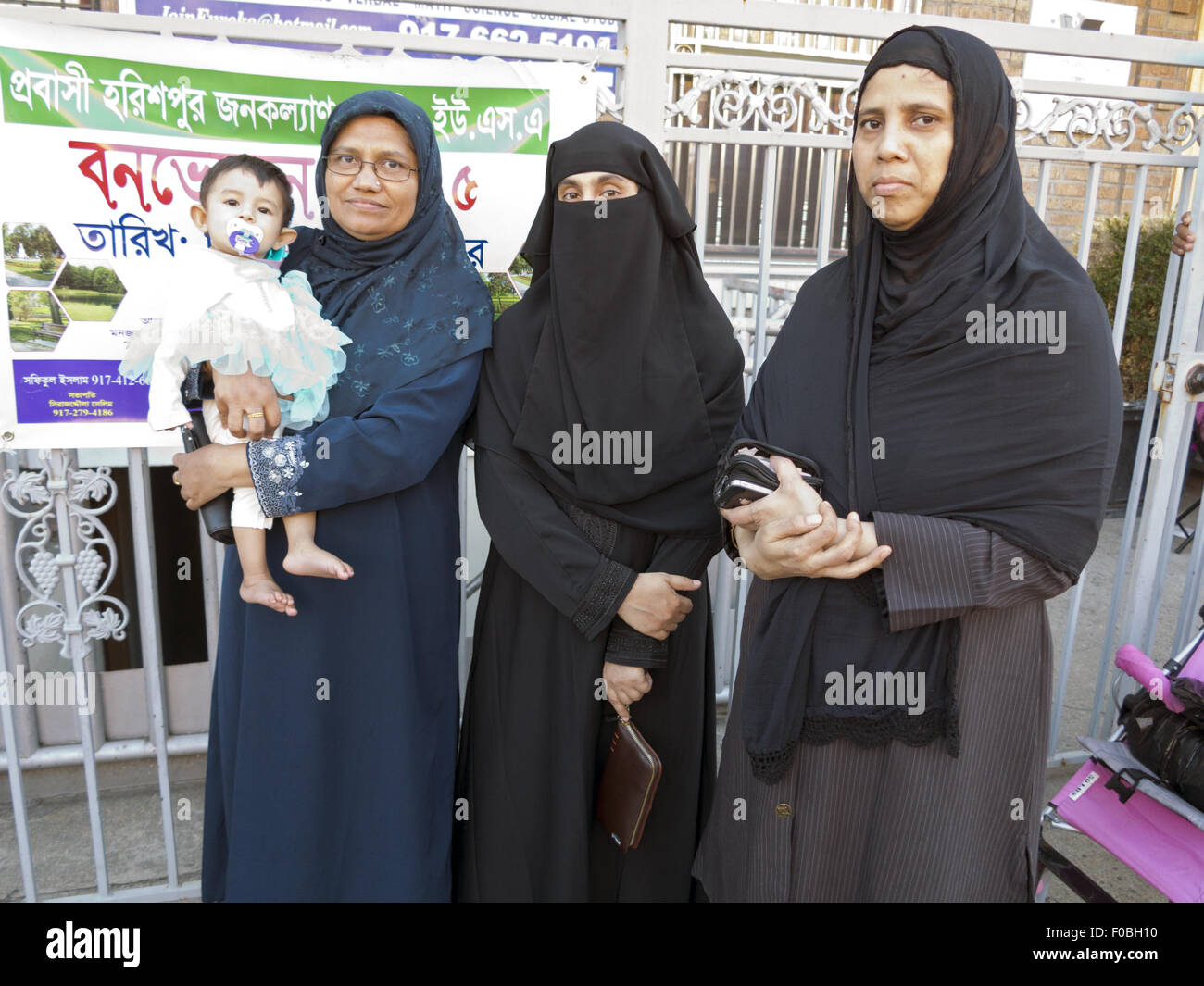 Bangladeshi women in modest dress at street fair and festival in 'Little Bangladesh' in the Kensington section of Brooklyn, NY. Stock Photo