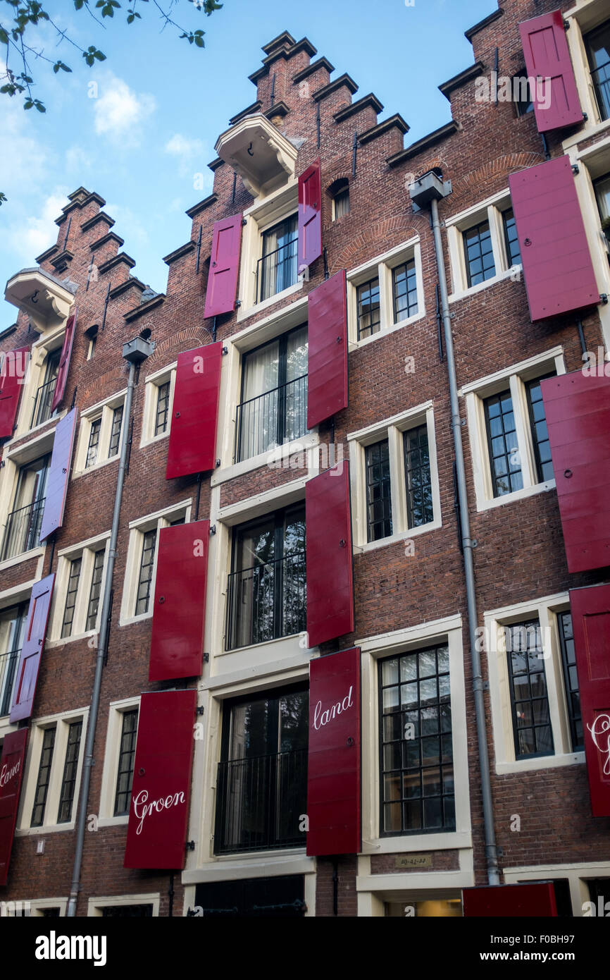 Typical dutch house in Amsterdam with red shutters Stock Photo
