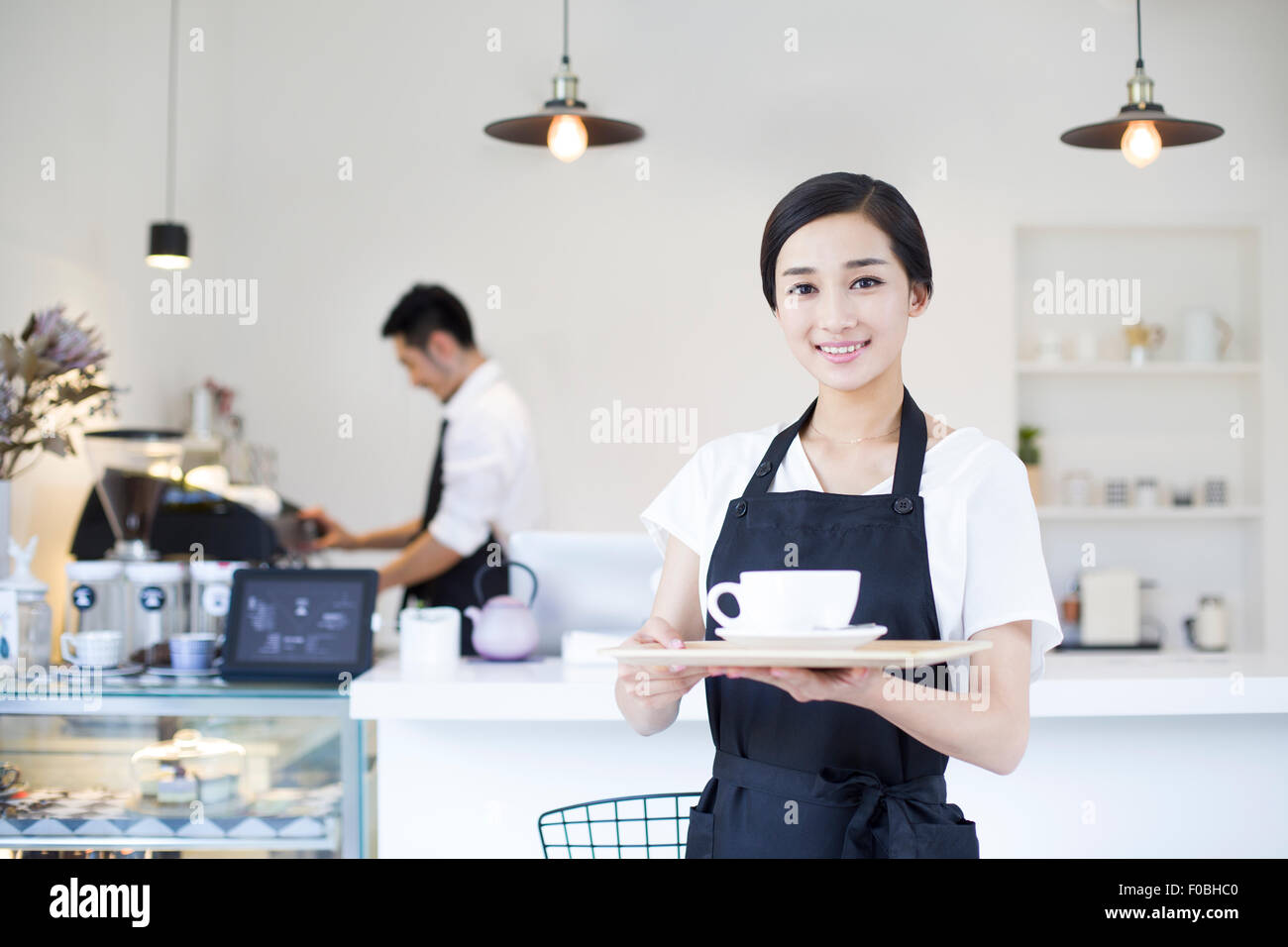 Portrait of coffee shop waitress Stock Photo Alamy