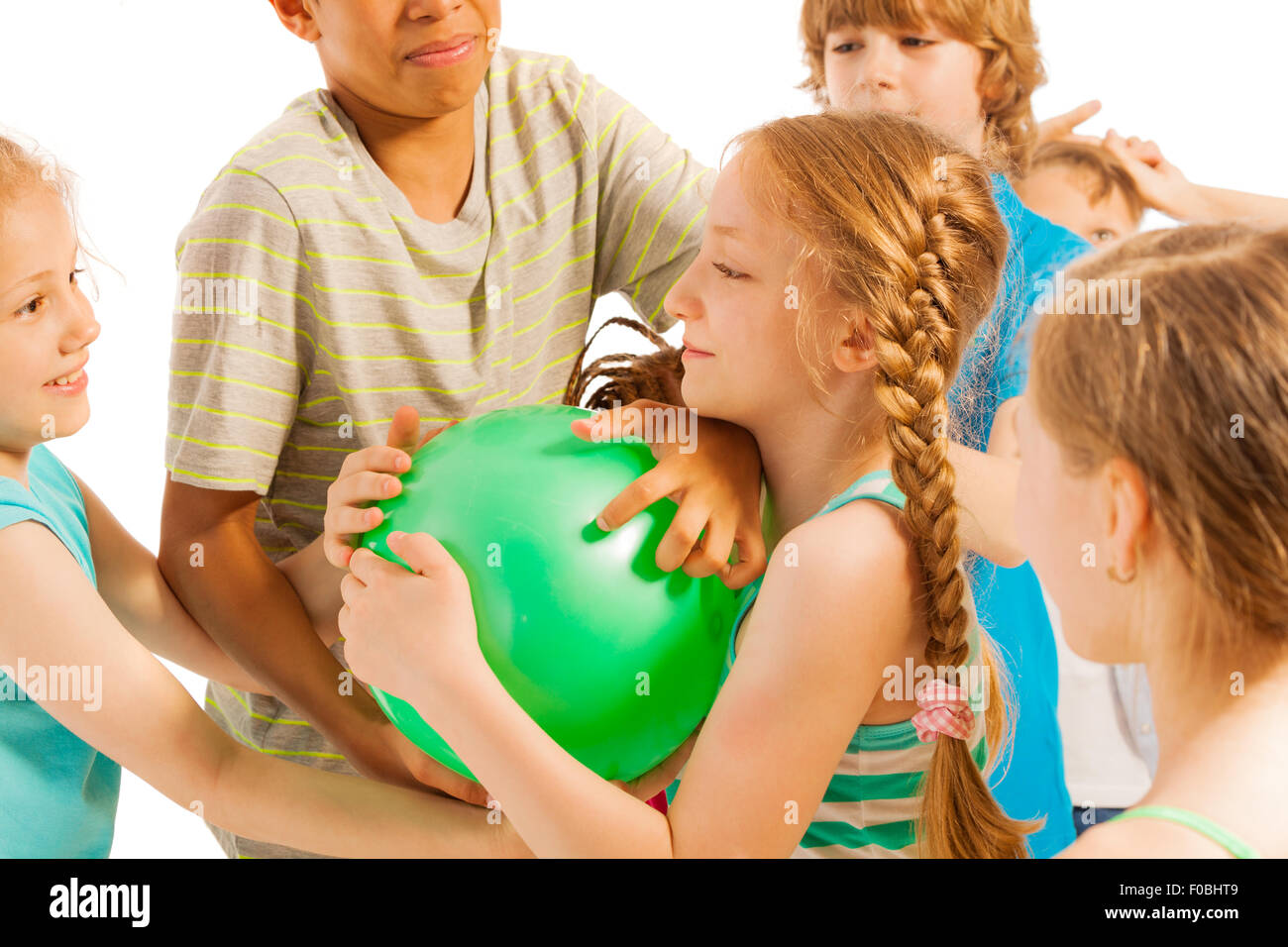 Group of kids fighting over the ball Stock Photo
