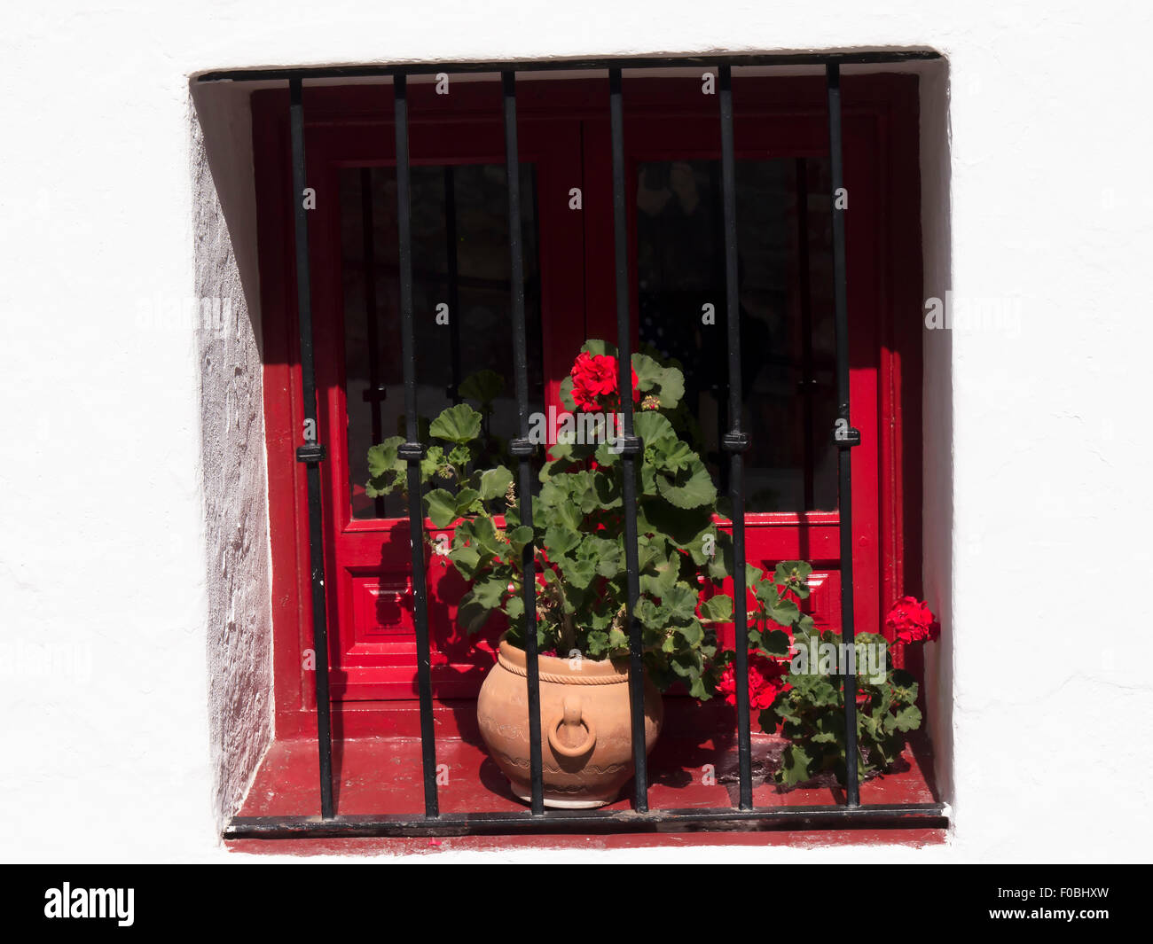 Window in Mijas one of the most beautiful 'white' villages of Andalucia. It is in the Alpujarra mountains above the coast Stock Photo