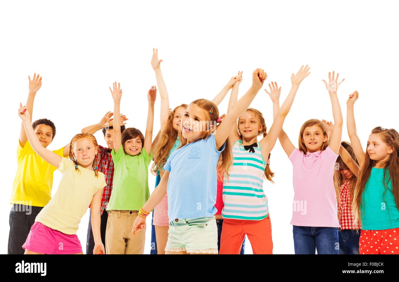 Happy smiling kids rise hands and cheer Stock Photo