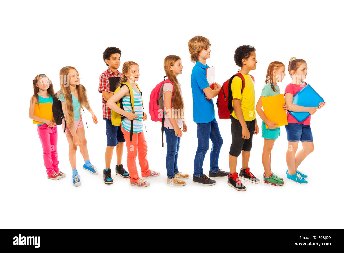 Many happy kids in a line to school Stock Photo