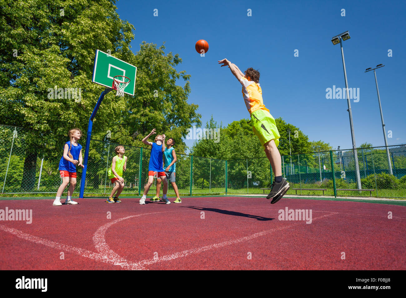 Boy performs foul shot at basketball game Stock Photo - Alamy