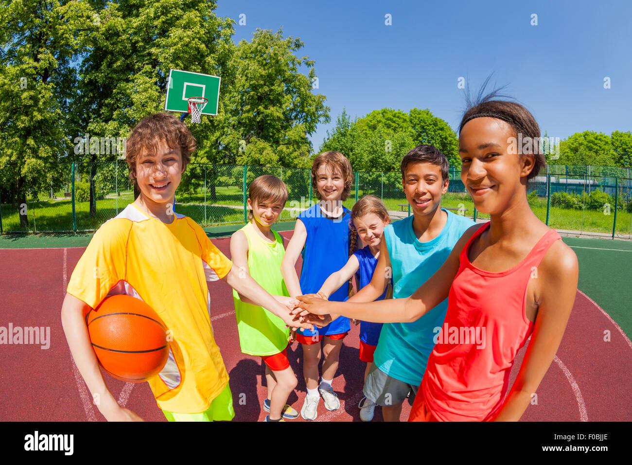 Close-up of teens with arms in star shape Stock Photo