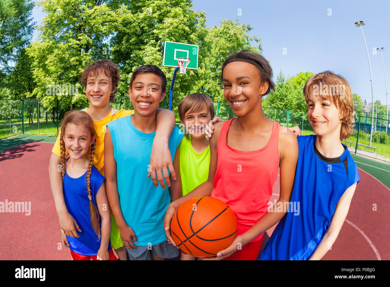 Basketball teenage team standing close after game Stock Photo