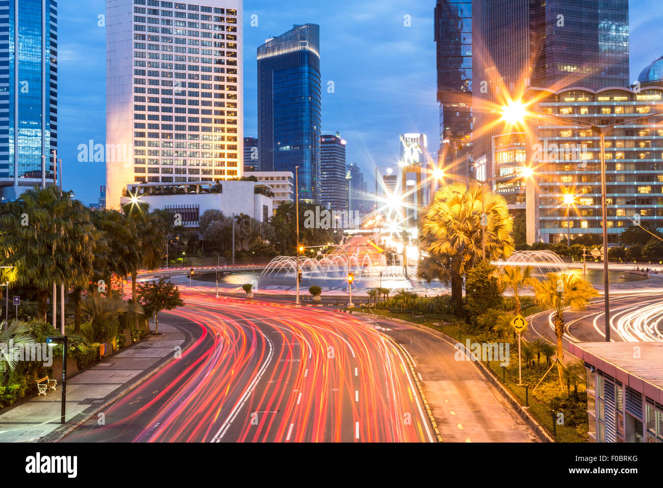 Long exposure of the traffic around Plaza Indonesia in Jakarta at night Stock Photo