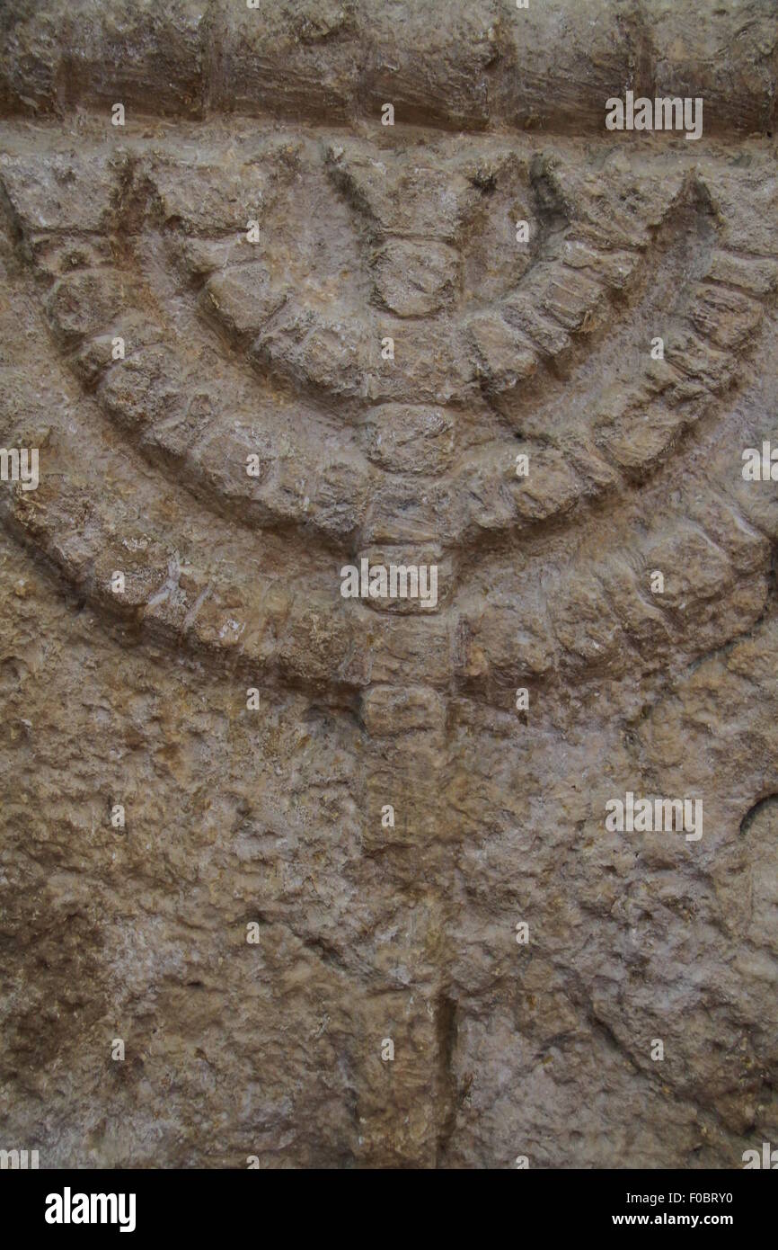 A lintel decorated with a Menorah, Eshtamoa Synagogue, 3rd-4th century AD, on display at the Rockefeller Museum Stock Photo