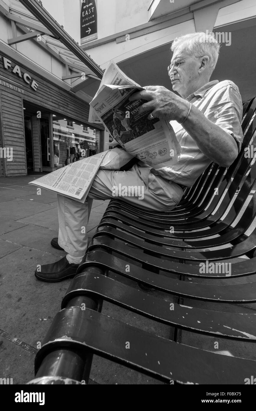 Man Reading Paper On Bench High Resolution Stock Photography and Images ...