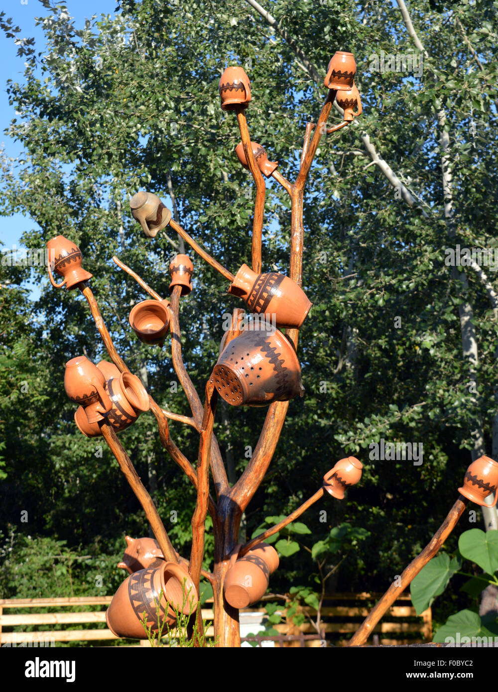 Jugs on an ornamental tree to lure and trap insects from surrounding fruit trees Stock Photo