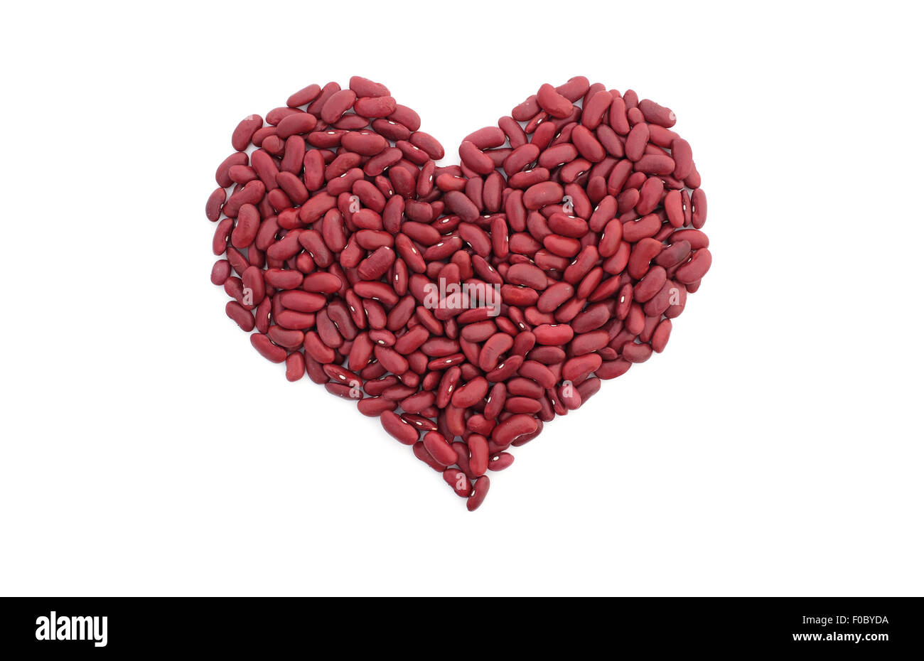 Red kidney beans in a heart shape, isolated on a white background Stock Photo