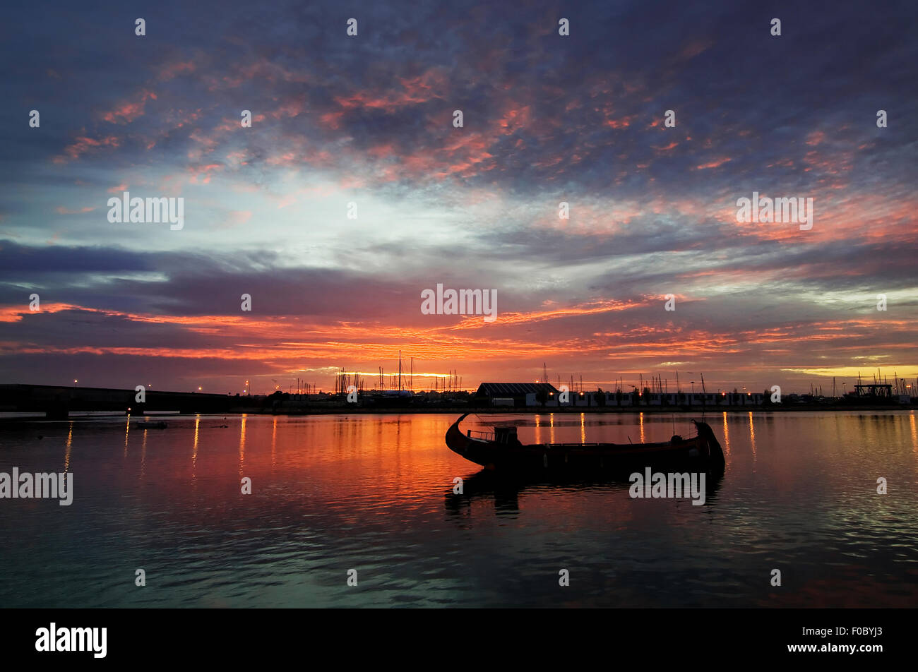 Beautiful sunrise on the river with boat Stock Photo - Alamy