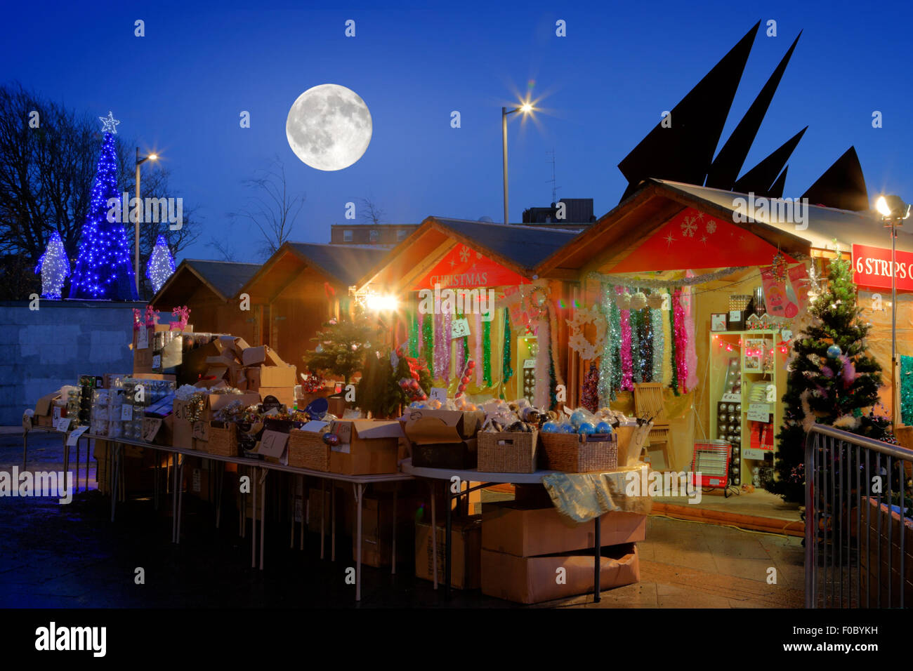 Continental Christmas Market in Eyre Square, Galway, at night time and full moon Stock Photo