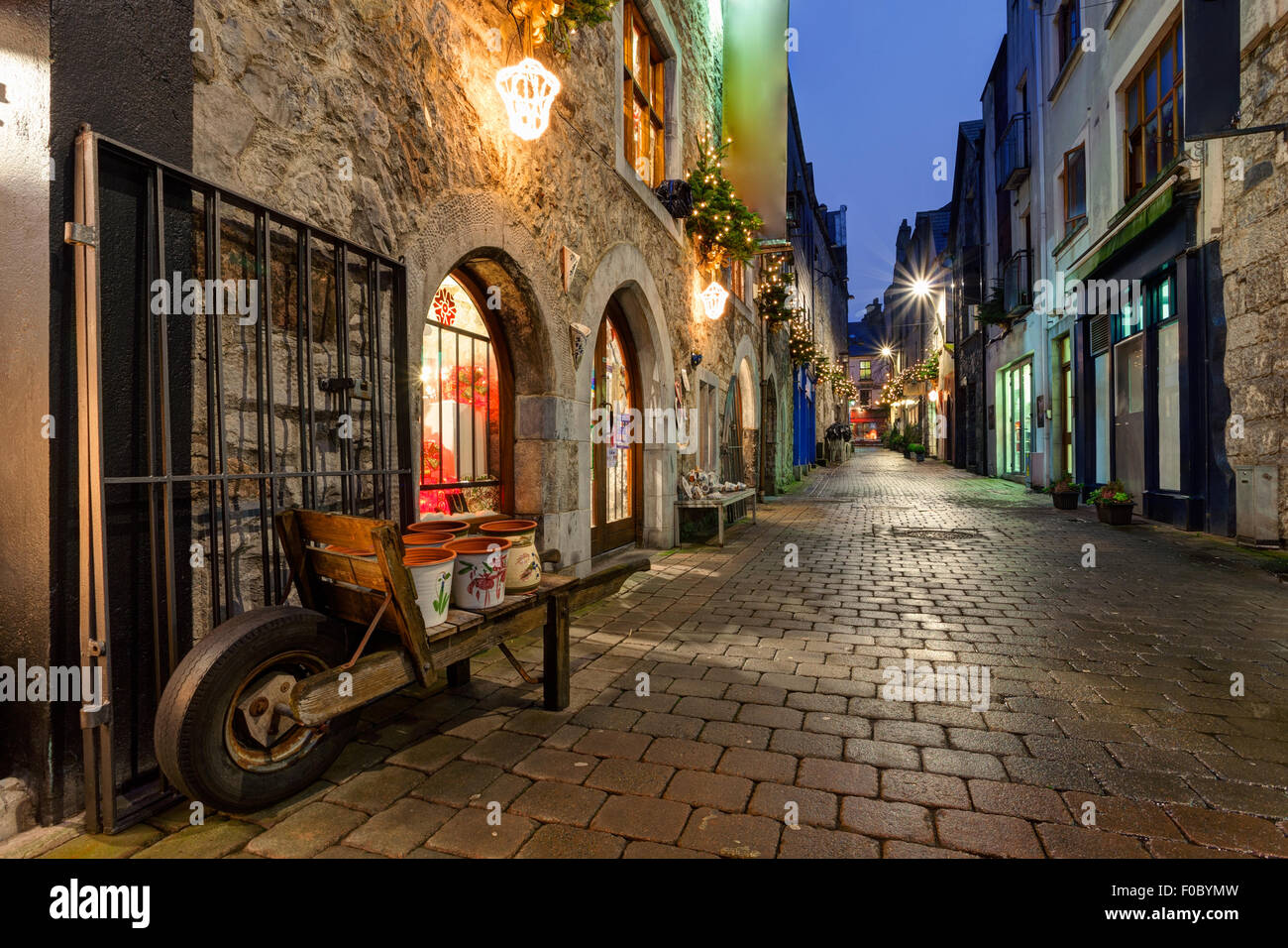 Old street in Galway, Kerwan's Lane, decorated with christmas lights, night scene Stock Photo