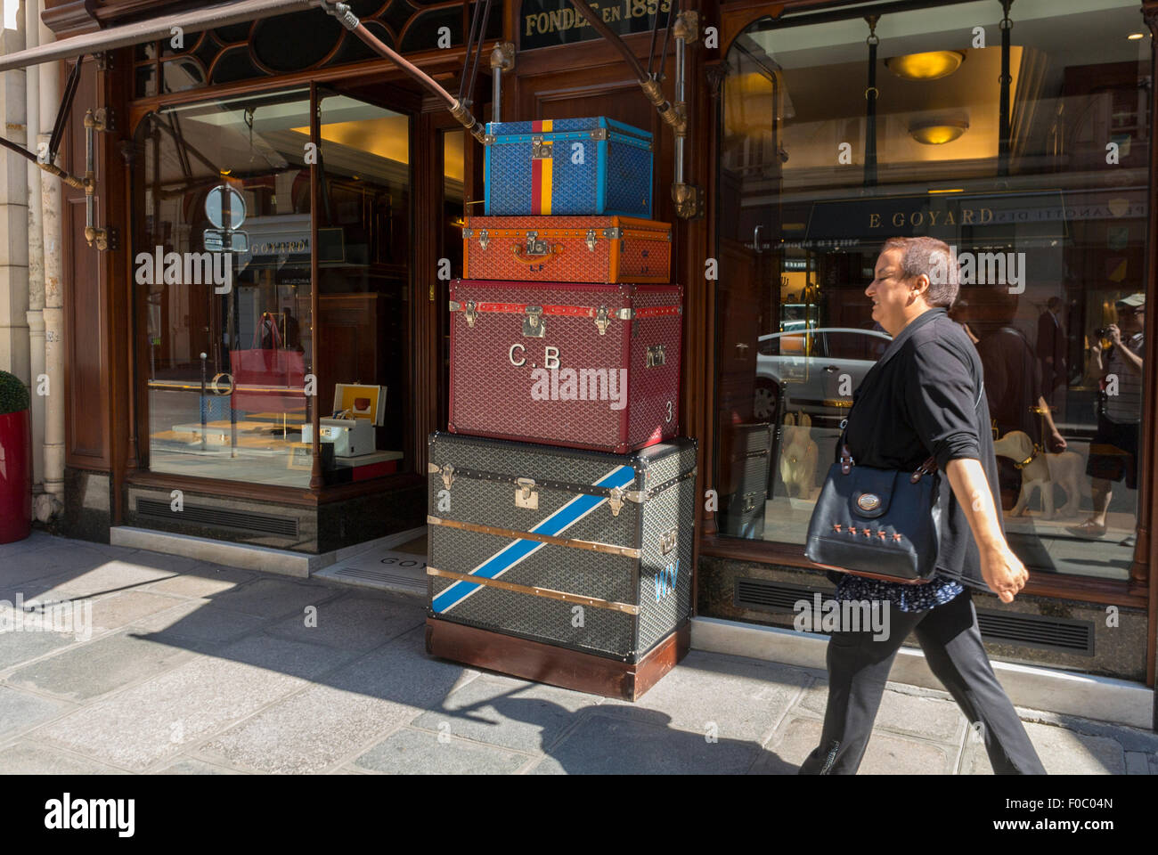 Paris, France, Luxury Product Display, Shop Window, Famous Brand Store,  E. Goyard, Luggage, Rue de Faubourg Saint Honoré, Woman Walking in Front Stock Photo