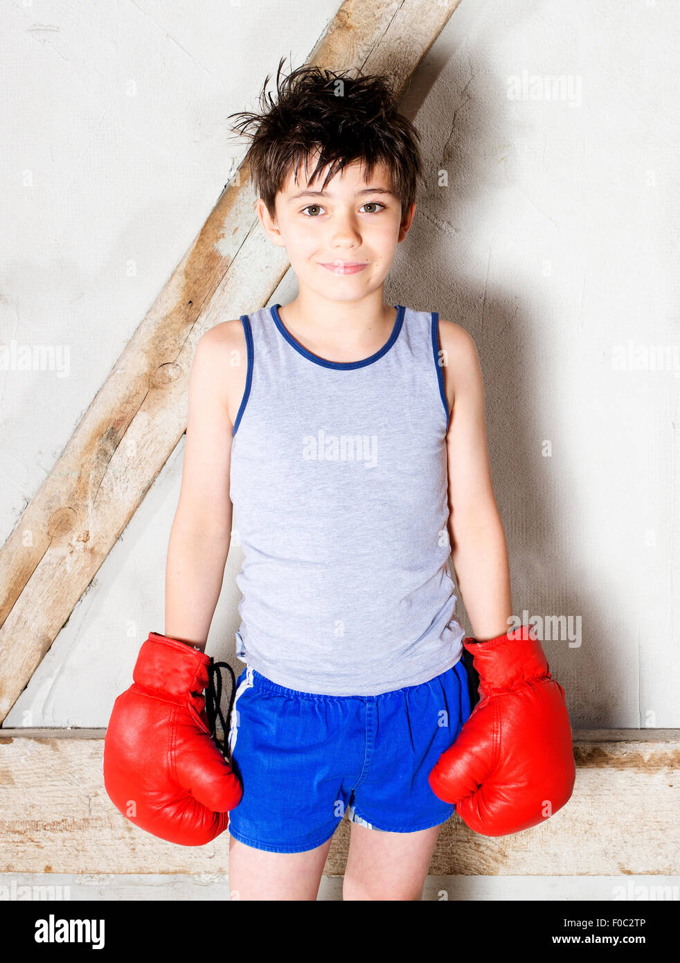 RFF0C2TP–young. boy with red boxing gloves. 