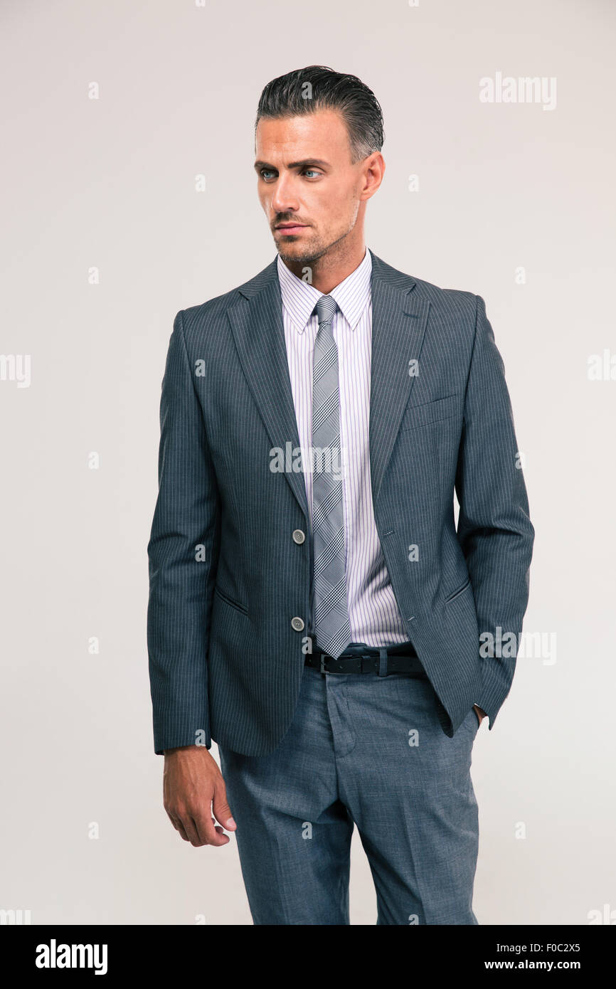Portrait of a confident businessman standing isolated on a white ...
