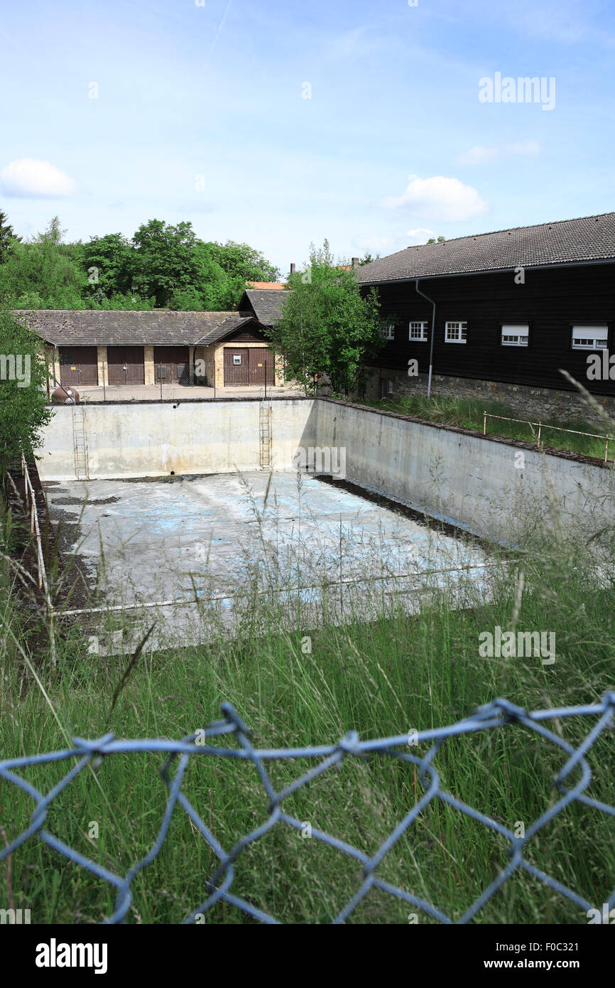 Empty former swimming pool in a former british army recreation camp at ith ridge, holzen, lower saxony, germany, europe Stock Photo