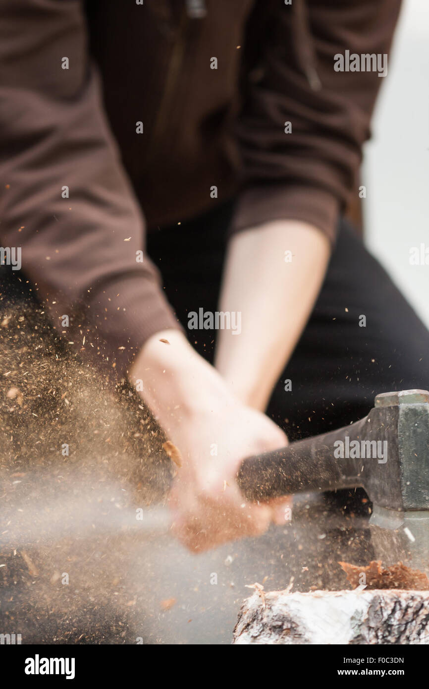 Wood chopping with hand axe Stock Photo Alamy
