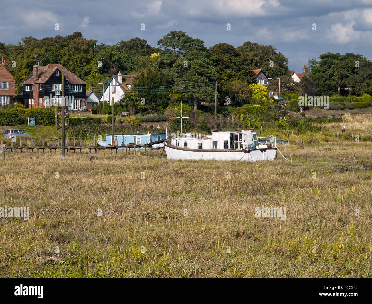 Houseboats on shoreline at West Mersea. Mersea Island. Essex. England