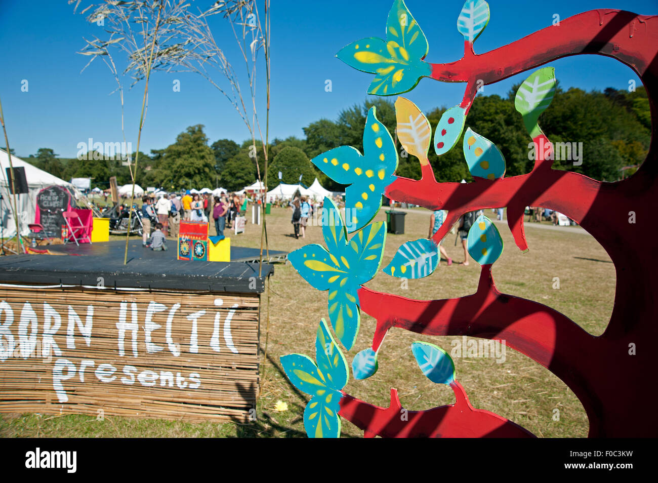Detail of wooden tree stage prop in the summer sunshine at the Port Eliot Festival in Cornwall Stock Photo