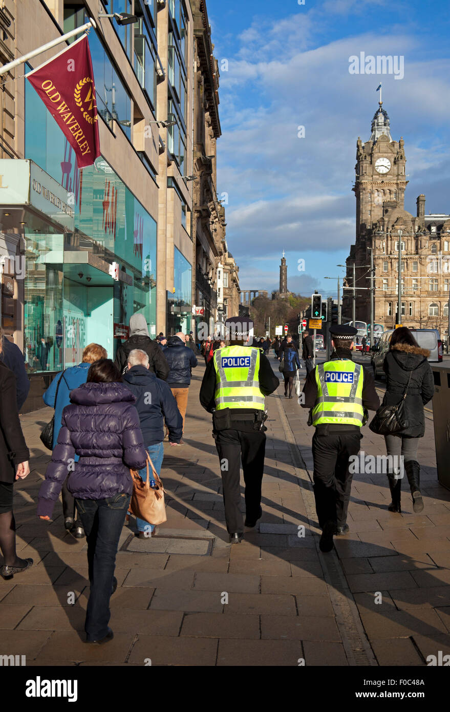 Policemen walking in Princes Street Edinburgh Scotland Stock Photo