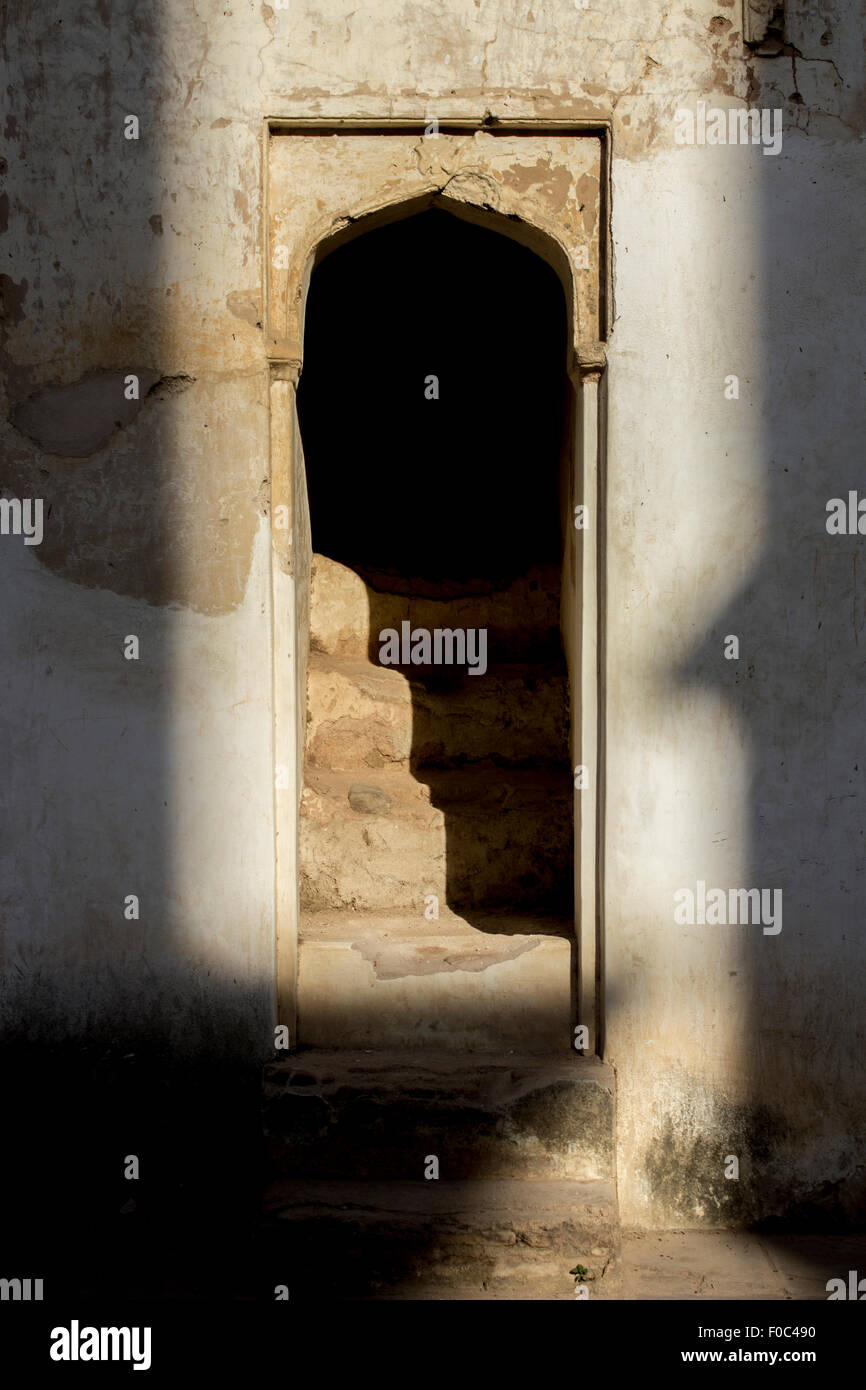 Face of shadow - An unreal Identity portrait on stair and wall Stock Photo