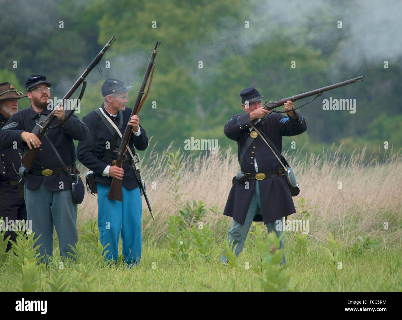 Gettysburg reenactment Union soldiers firing musket Stock Photo