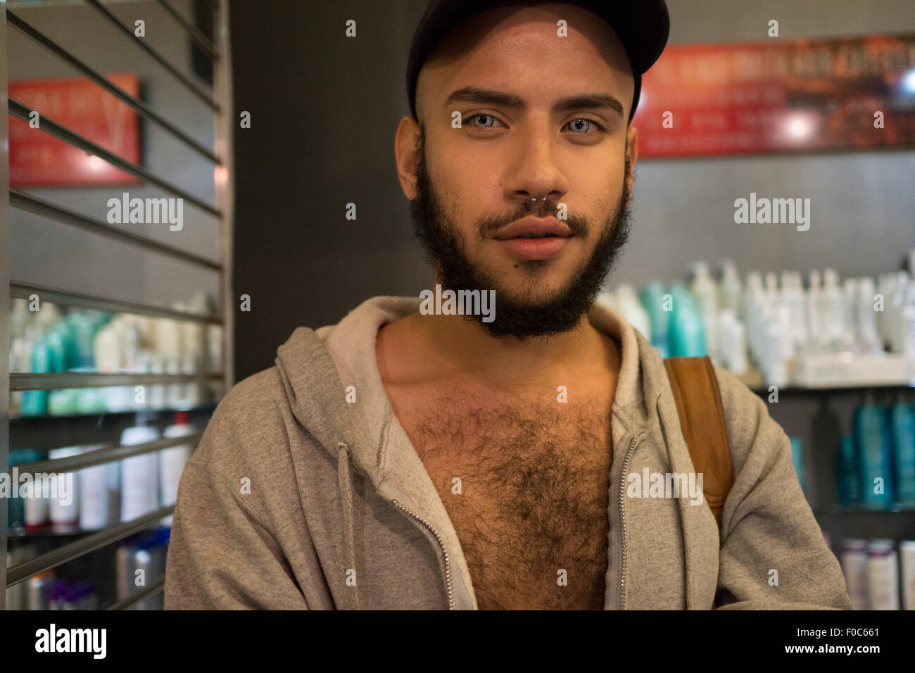 A young man who works as a receptionist in a beauty salon. Aug. 11, 2015 Stock Photo